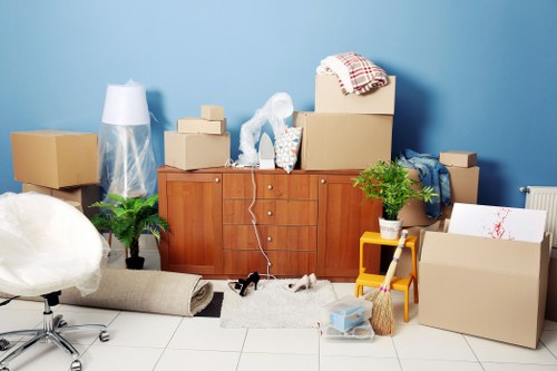 Organised self storage space in Southfields with boxes and furniture