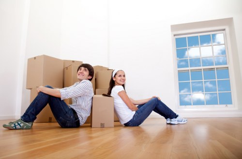 Organised storage unit in Southfields with packed boxes